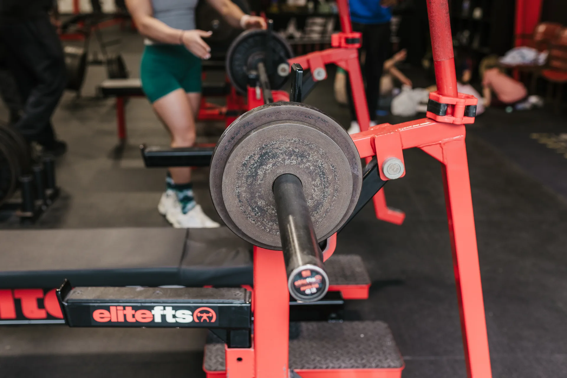 A loaded barbell racked and ready