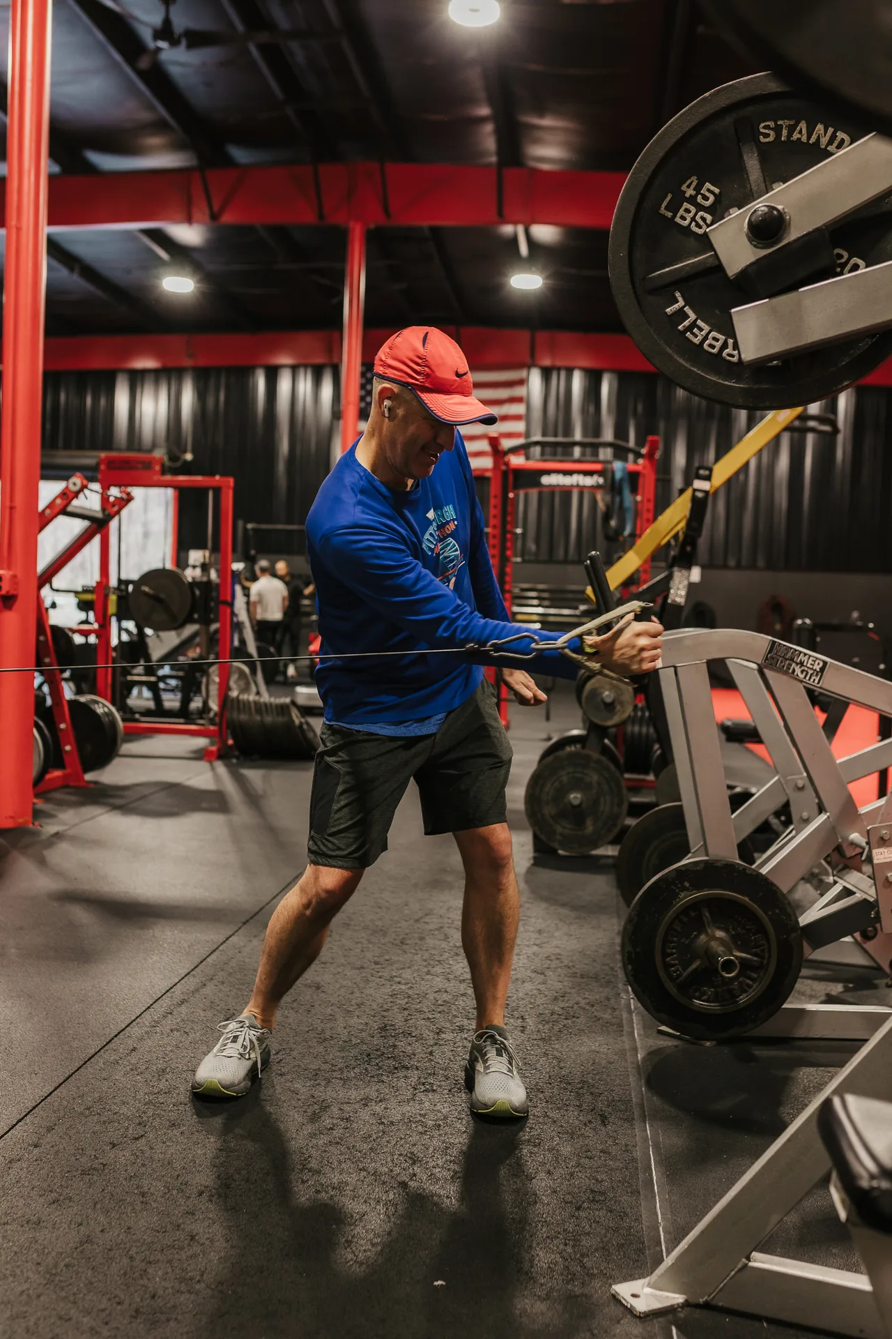 Athlete training with a cable sled